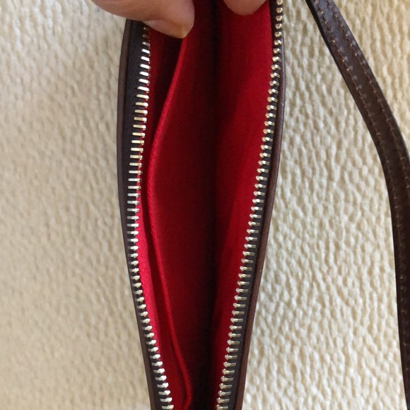 Beautiful brownish burgundy patent leather Dooney Bourke purse with handle. - Picture 3 of 3